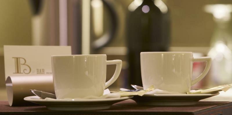 Portobay Flores Exterior photo Two cups of coffee